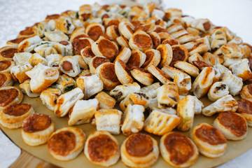 Italian pastry with sauce of tomatoes and meat stand on wooden d