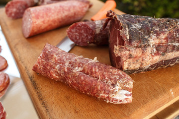 Salted meat on wooden board