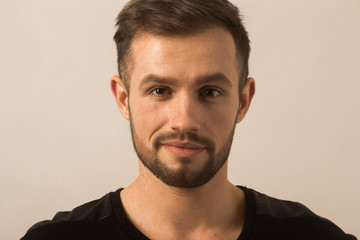 Fototapeta premium portrait of a successful young man on a light background . the p