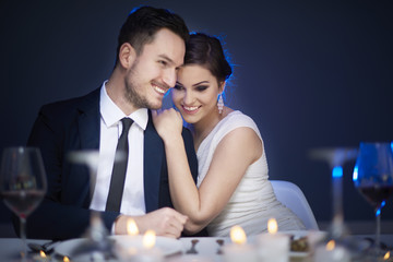 Young couple enjoying romantic meal together