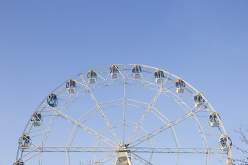 Carousel against the blue sky