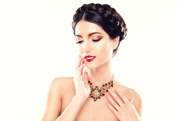 Gorgeous Brunette Woman. Portrait of Beautiful Model with Perfect Bright Make up, Red Lips, Orange Jewelry. Sexy Lady Makeup for Party. Girl with Elegant Braided Hairdo, Colorful Make Up and Necklace