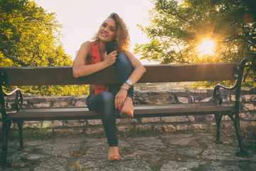 Beautiful woman drinking coffee outdoors.

