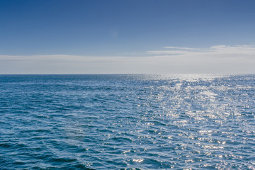 Blue sea with sunlight reflected on it