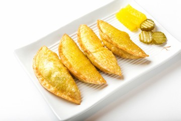 mandu twigim Fried Dumplings on plate