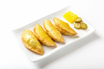 mandu twigim Fried Dumplings on plate