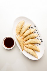 mandu twigim Fried Dumplings on plate