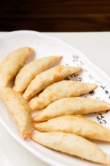 mandu twigim Fried Dumplings on plate