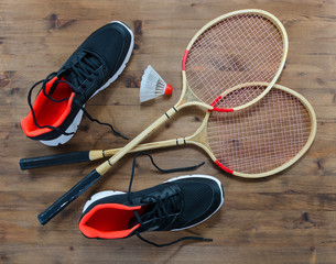 Shuttlecock and badminton racket with sport shoes