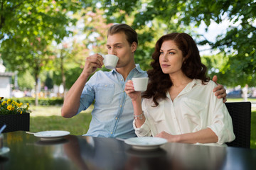 Young couple drinking tea together outdoor
