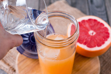water and juice in a glass shaker