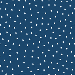 Messy hand-drawn dots seamless pattern. White dots on dark blue background. 