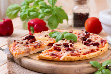 Tasty pizza on wooden table