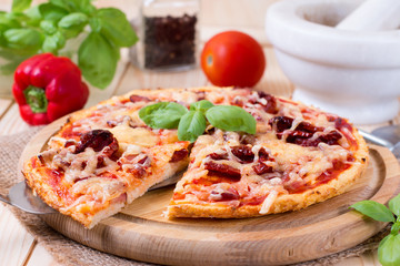 Delicious fresh pizza on wooden background