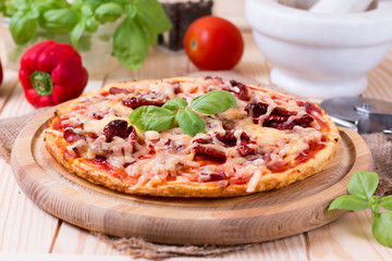Delicious italian pizza served on wooden table