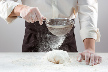 Hands kneading a dough