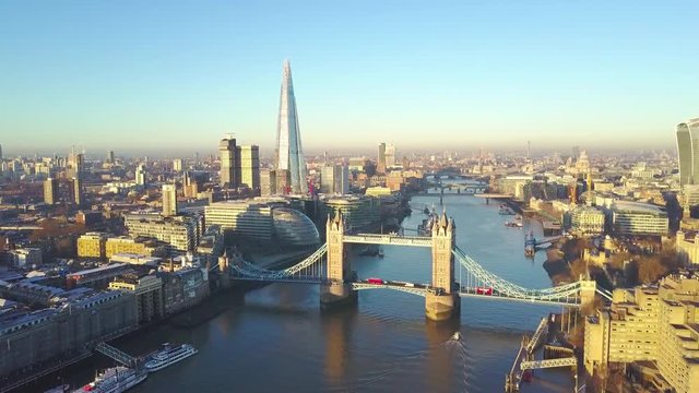 Orbit shot: Aerial cityscape view of London and the River Thames, England, United Kingdom
