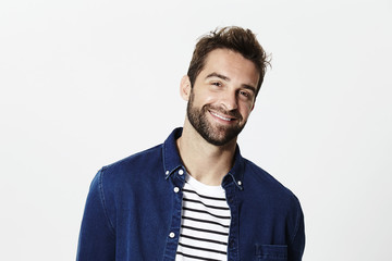 Happy guy in blue shirt and striped top