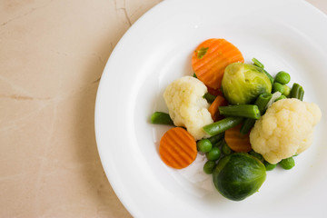 Vegetable salad in a white plate. Dietary dish.