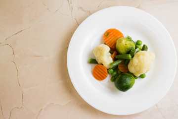 Vegetable salad in a white plate. Dietary dish.