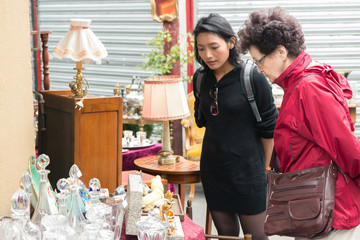 women looking at decorative goods on the market, Paris