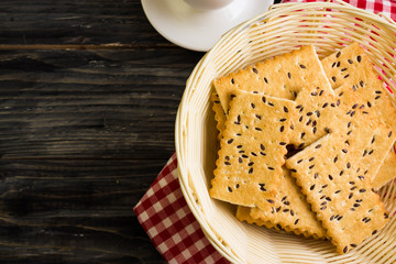 Crackers with sesame seeds on a wooden table in rustic style