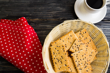 Crackers with sesame seeds on a wooden table in rustic style