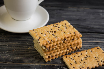 Crackers with sesame seeds on a wooden table in rustic style