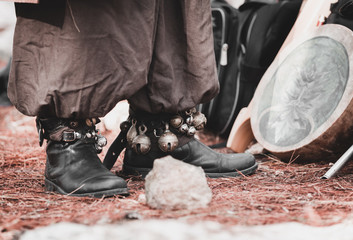 metal bells on a man's leg