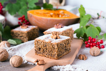 Fototapeta na wymiar Homemade pumpkin cake with nuts on the table