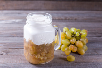 Sweet yogurt with berries on a wooden background