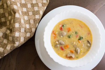 Flour soup with chicken giblets in a white bowl