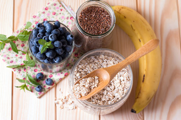 cereal and various delicious ingredients for breakfast, top view, closeup