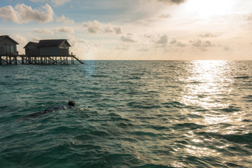 Beautiful tropical Maldives resort hotel with beach and blue wat