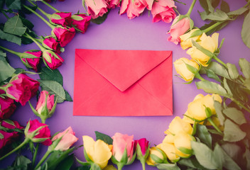 beautiful yellow and pink rose flowers and envelope