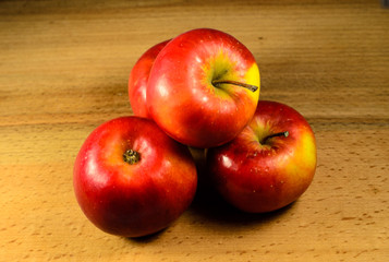 Pile of the apples on wooden table. Top view