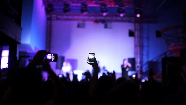 People take off concert on a mobile phone