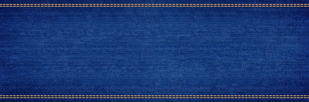 wide blue jeans denim panorama background with stitching