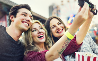 Friends Huddle Happiness Amusement Park Festival Concept