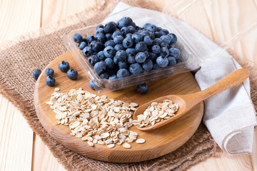 Fototapeta na wymiar Raw oatmeal with fresh blueberries
