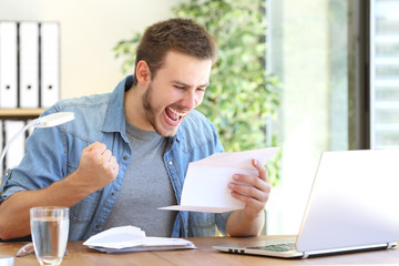 Excited entrepreneur reading a letter