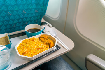 Healthy food on the plane with coffee .