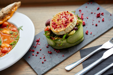 goat cheese salad with vegetables at restaurant