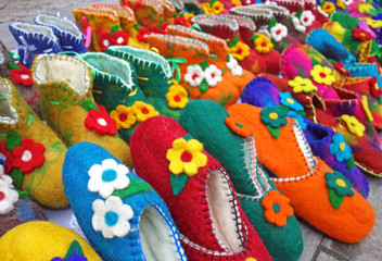 Handmade colorful wool slippers or shoes for sale at street in Tbilisi, Georgia