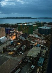 oil containers at falmouth docks at night