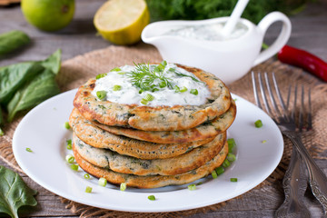 Green pancakes with spinach and sauce