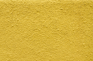 Texture of yellow painted concrete wall