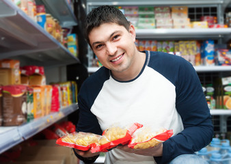 Male customer looking at assortment of pasta