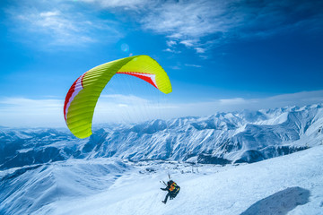 Winter in Greater Caucasus Mountains. Georgia (country). Gudauri ski resort. Paragliding