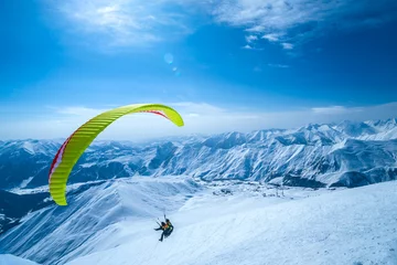 Poster de jardin Sports aériens Winter in Greater Caucasus Mountains. Georgia (country). Gudauri ski resort. Paragliding